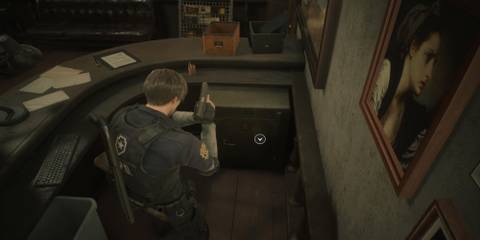 Leon Standing Over The Waiting Room Safe