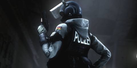 IQ with a pistol in her hand