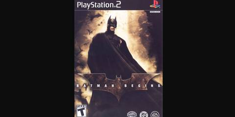 Batman standing with a light shining behind him in Batman Begins