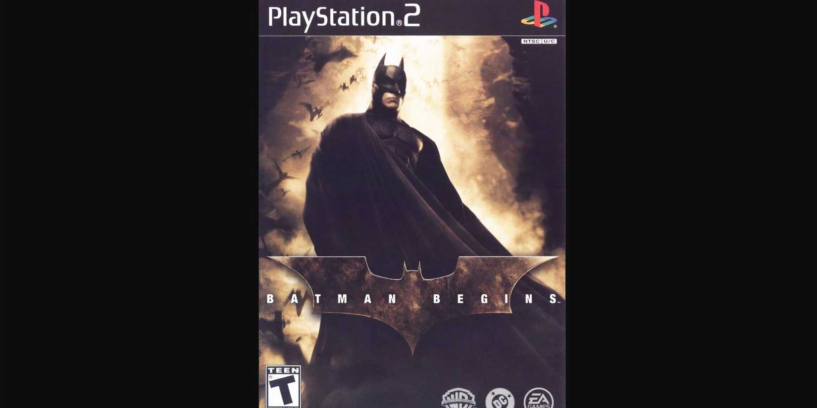 Batman standing with a light shining behind him in Batman Begins