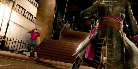 Masaru standing in the background