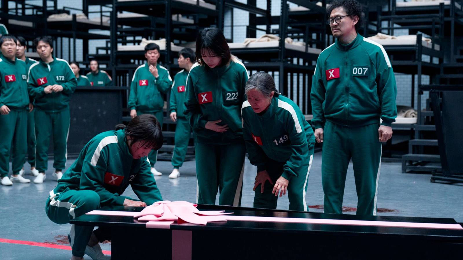 The surviving players reacting to the coffin of an unseen character.