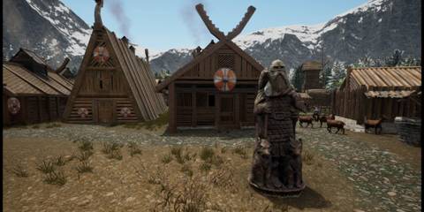 A Norse Statue with a House Behind From Land of the Vikings