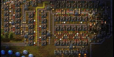 An Early Stage Layout of a Factory in Factorio