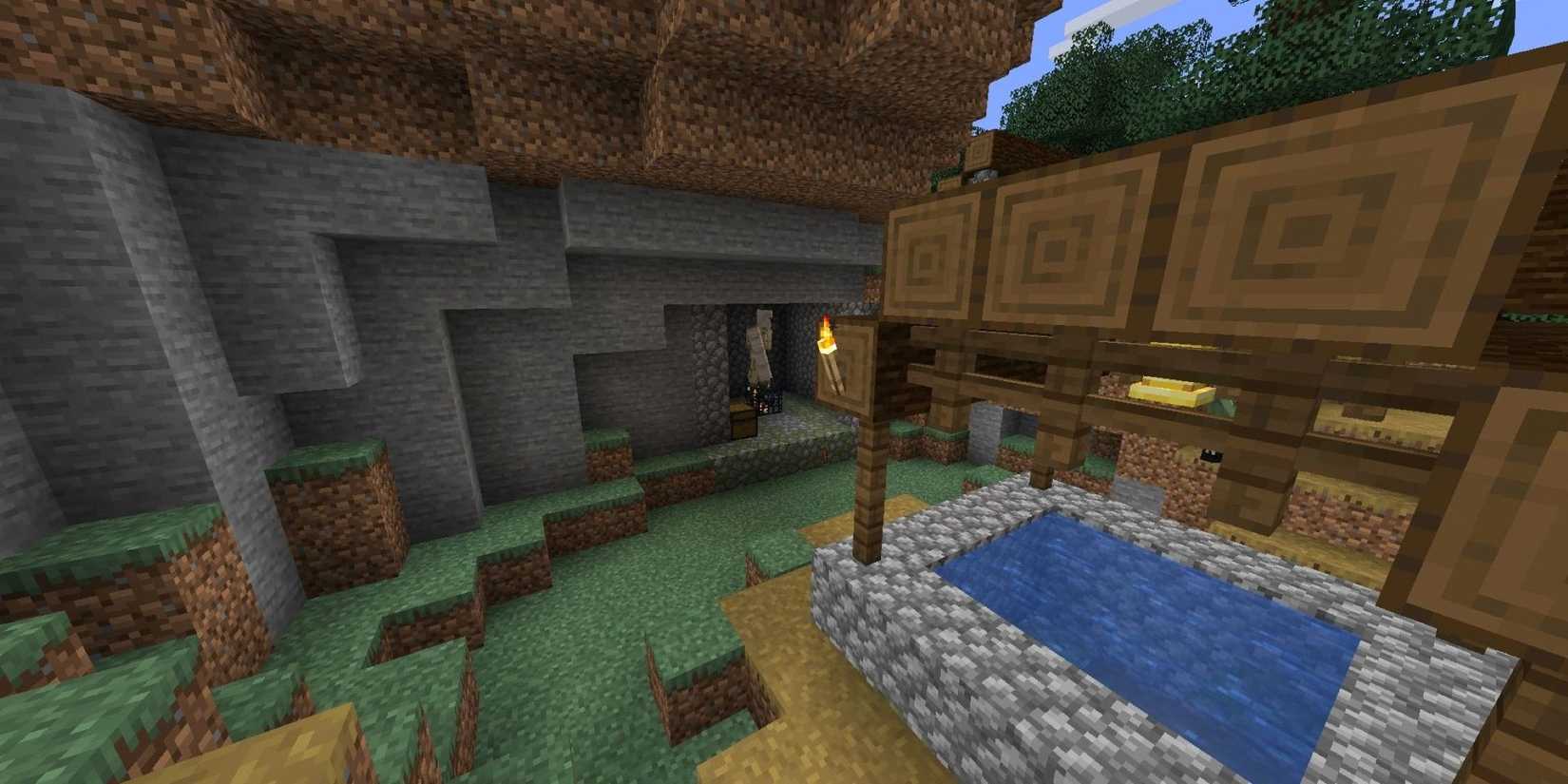Village well with dungeon in side of cliff next to it