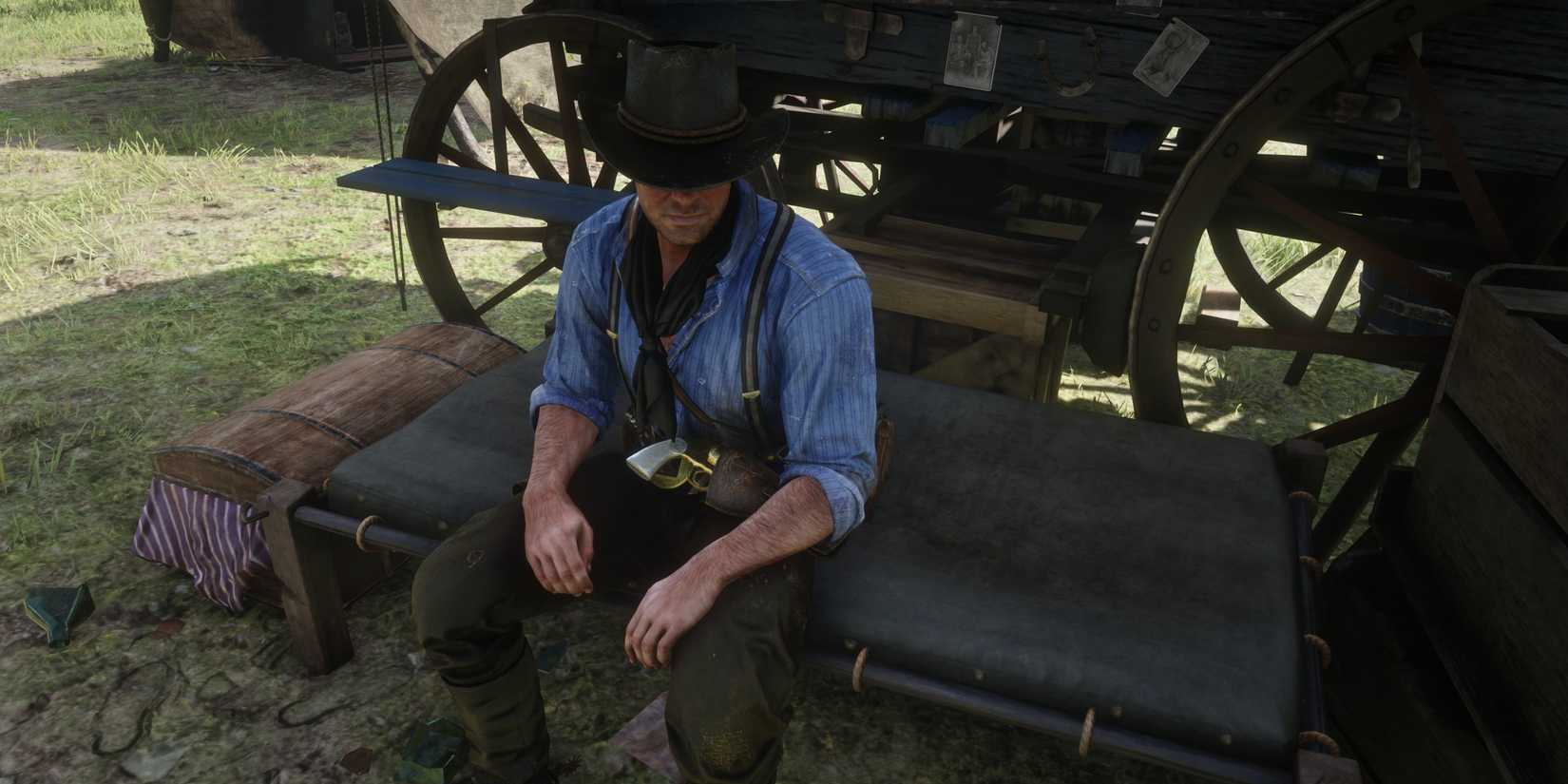 arthur sits on his bed