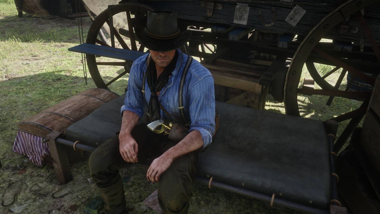 arthur sits on his bed