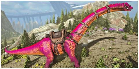 Pink and orange brontosaurus wearing saddle