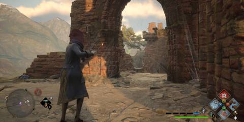 Destroying spider webs in the Mountain Vivarium ruins in Hogwarts Legacy