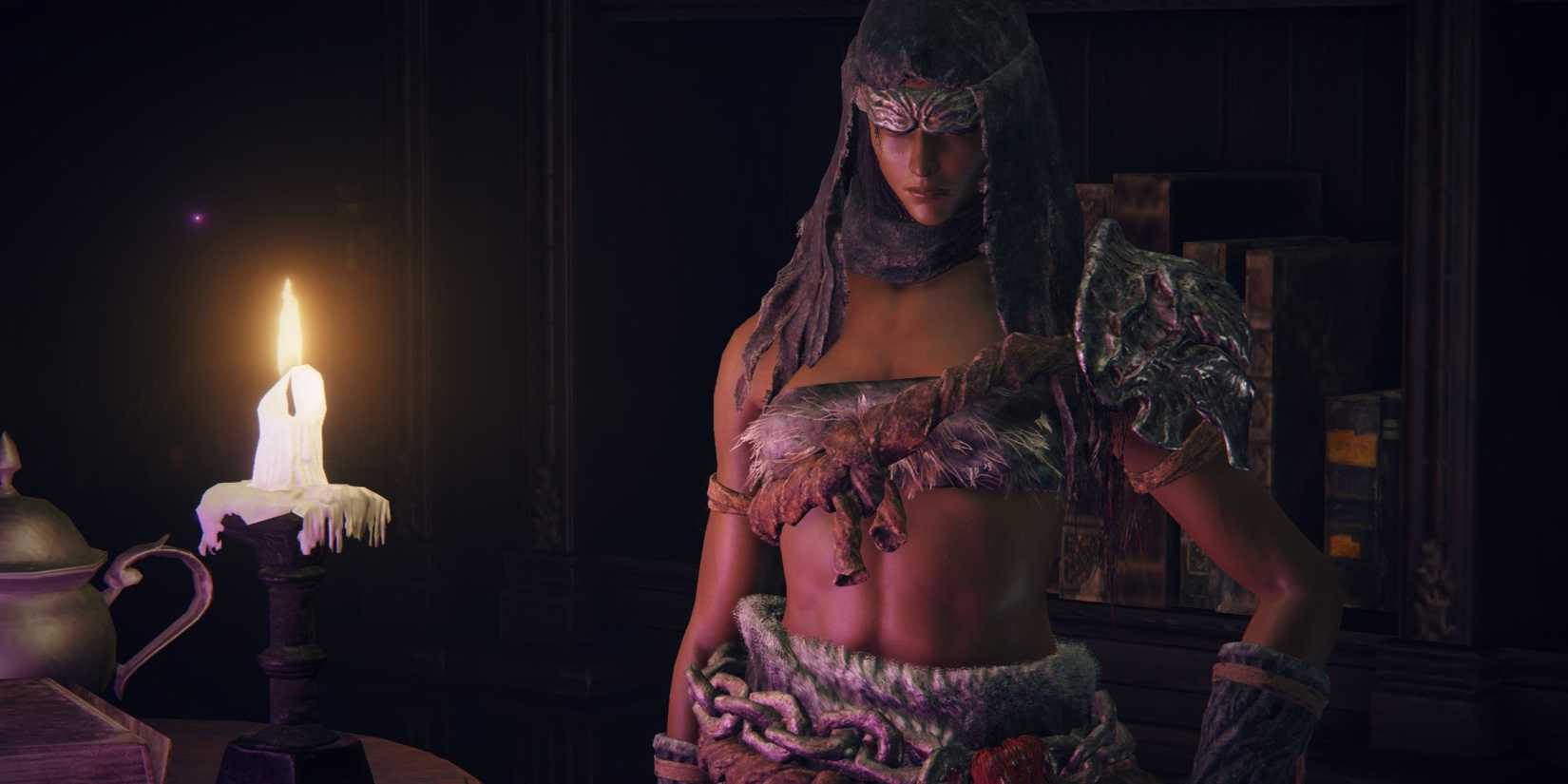 Elden Ring Nepheli Loux standing next to a candle