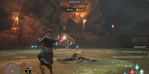 Fighting a Mountain Troll in Hogwarts Legacy's Dark Arts Battle Arena