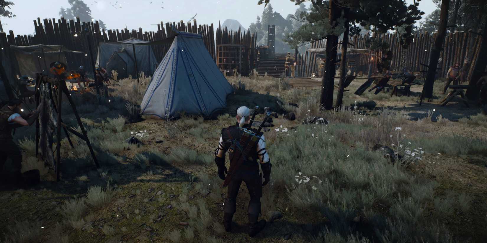 Geralt stands in a fortified camp with a large tent in The Great Arena, one of the best Witcher 3 RedKit mods