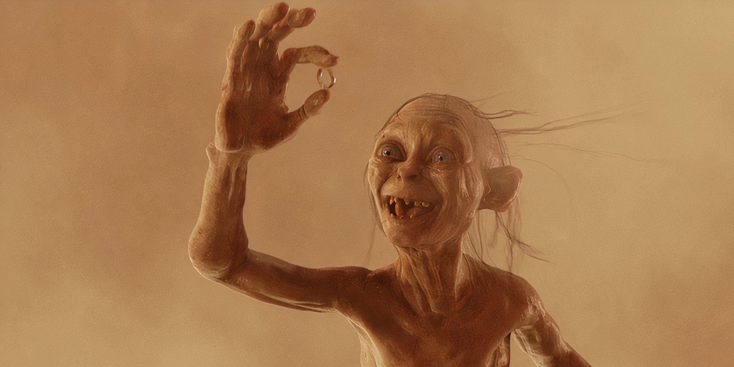 Gollum holding up the ring 