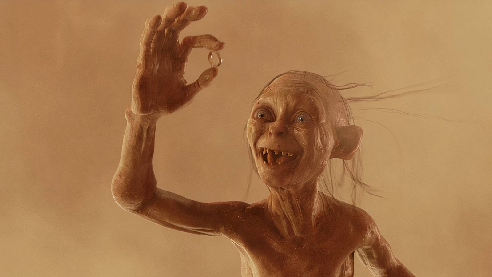 Gollum holding up the ring 