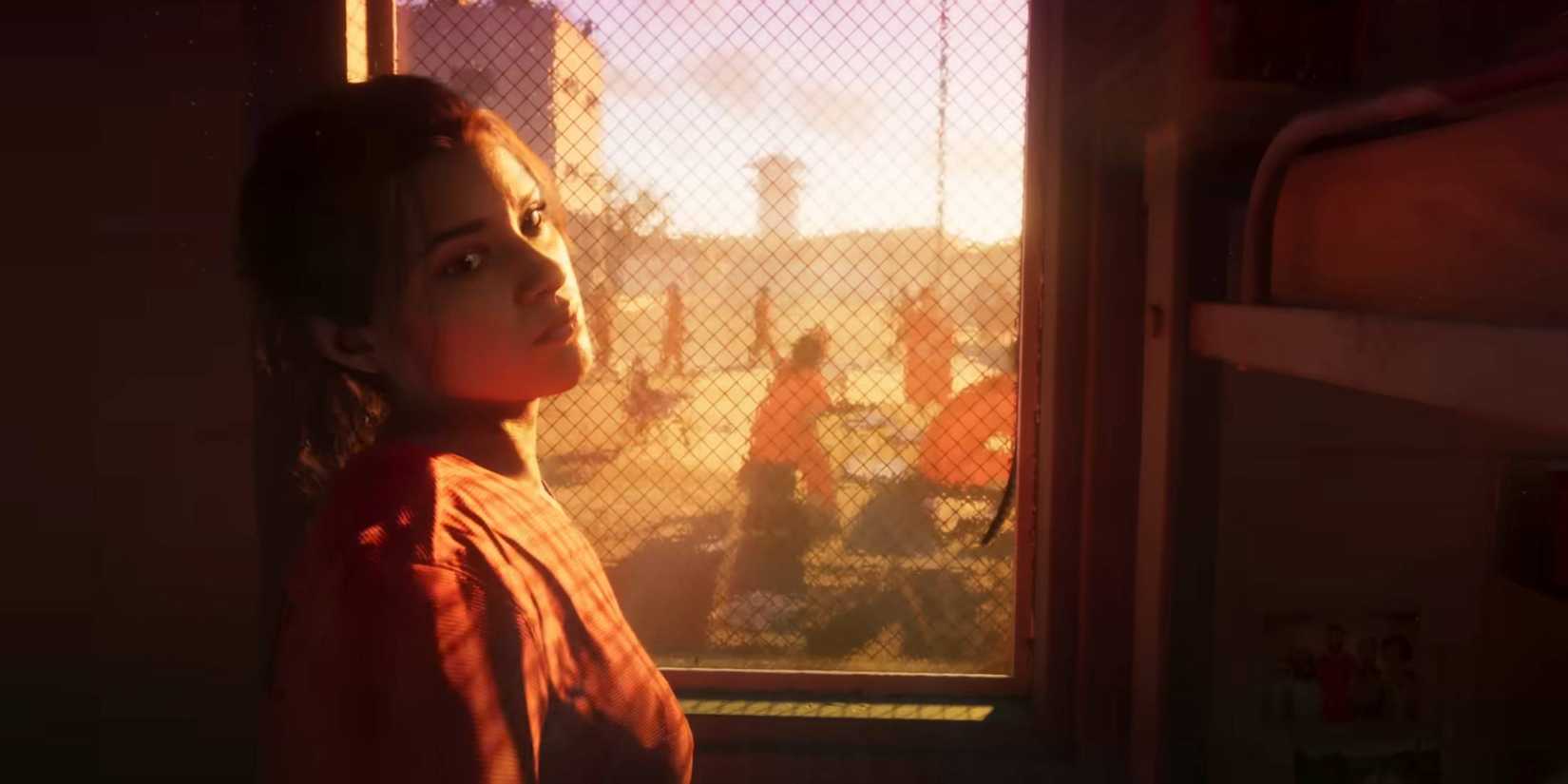 Lucia standing by a window in a prison jumpsuit from Grand Theft Auto 6's trailer