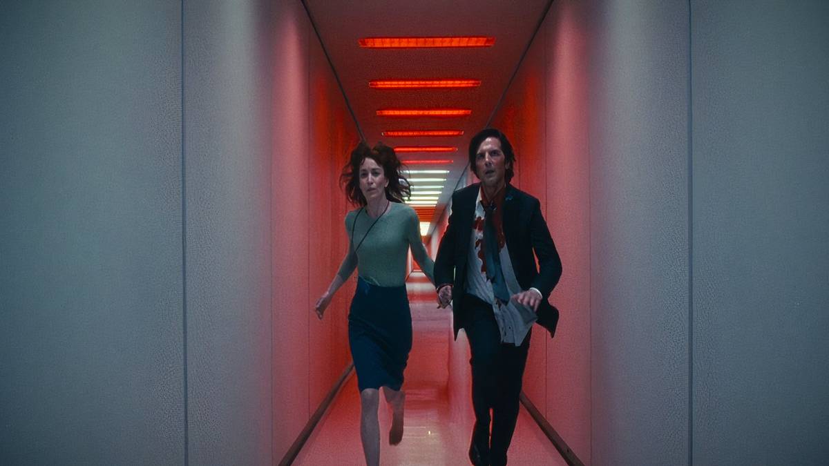 Helly R and Mark S runaway together down a corridor in Severance