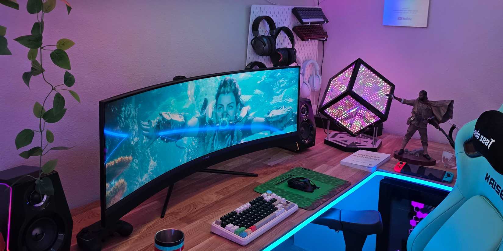 A gaming setup with an ultrawide monitor