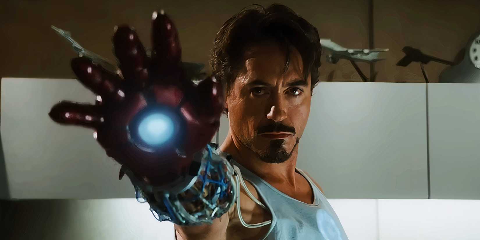 Tony Stark aiming his repulsor in Iron Man (2008)