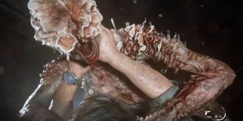 Joel being attacked by a clicker in The Last of Us Part 1
