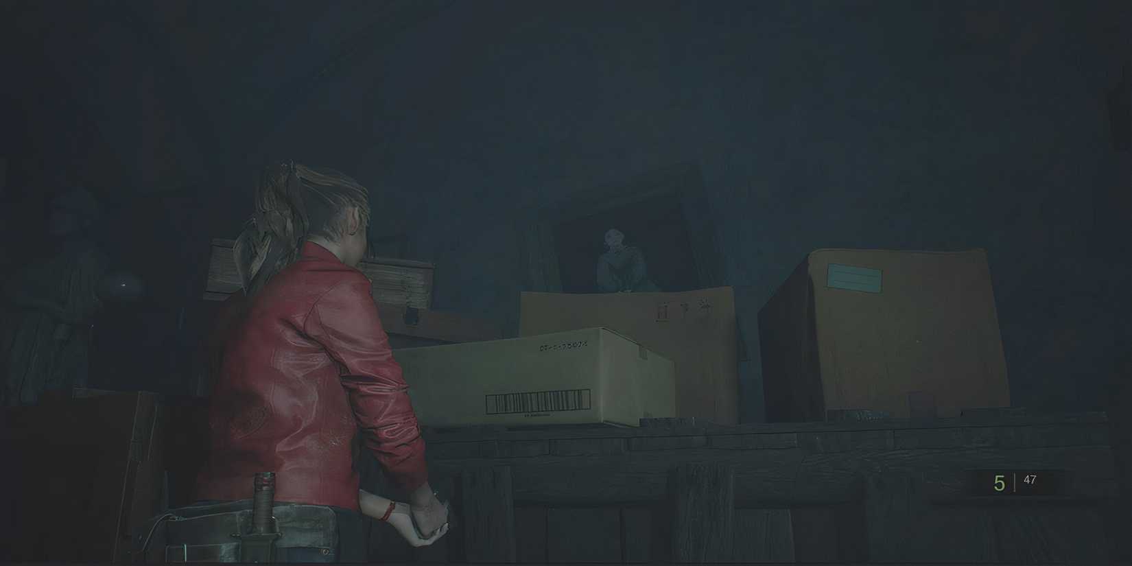 claire staring at a painting behind a box