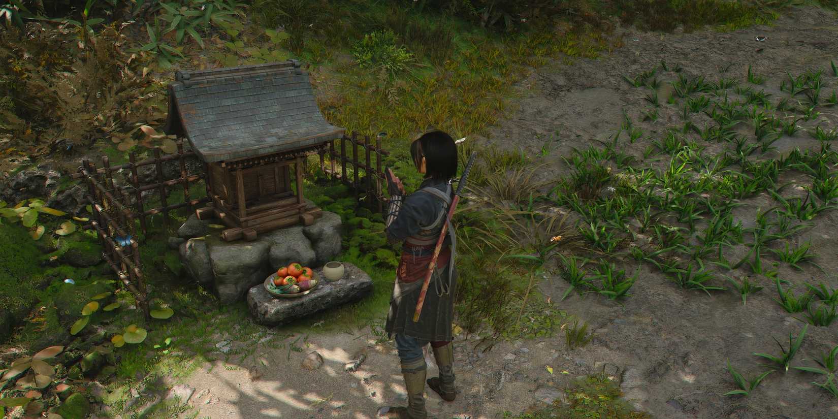 Praying at a shrine in Assassin's Creed Shadows