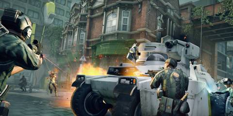 Soldiers shooting enemies in a street from behind a tank 