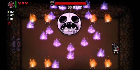New face/skull boss with flames surrounding it in caves