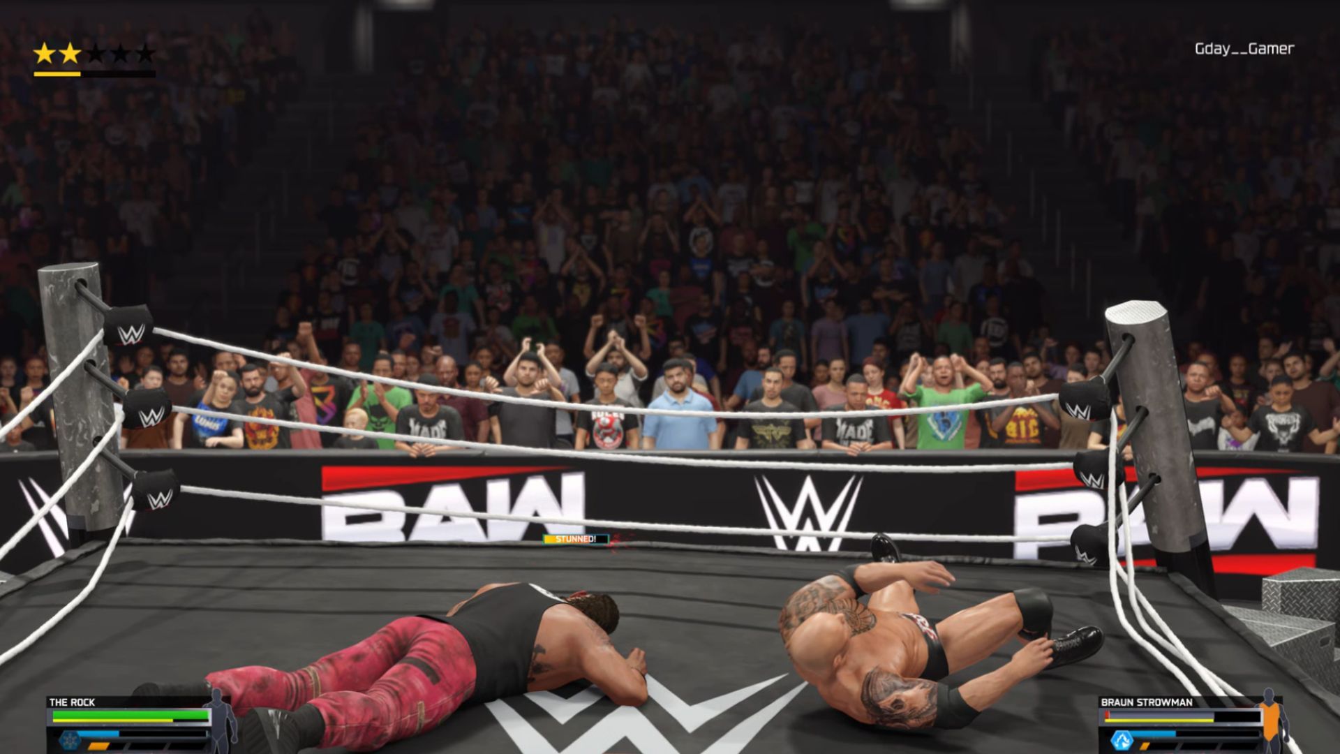 Rocks and Brown Strawman are lying on the ground and breaking the ring on WWE 2K25.