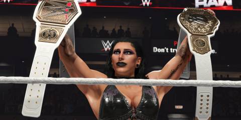 WWE 2K25 screenshot of Rhea Ripley holding two titles in MyRISE