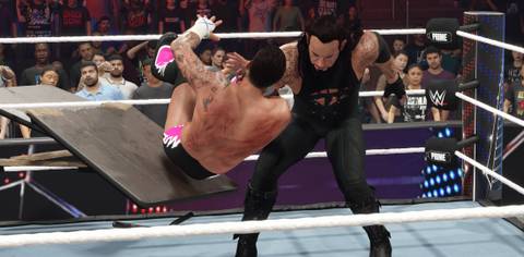 WWE 2K25 Undertaker choke slams punk through the table