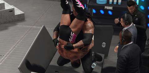 WWE 2K25 Undertaker hits the finisher through the announce table