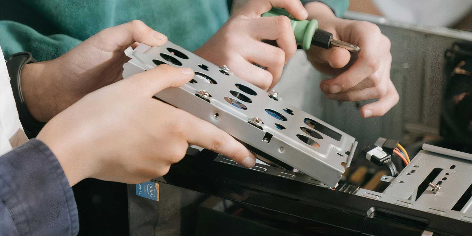 Person swapping out an HDD for an SSD