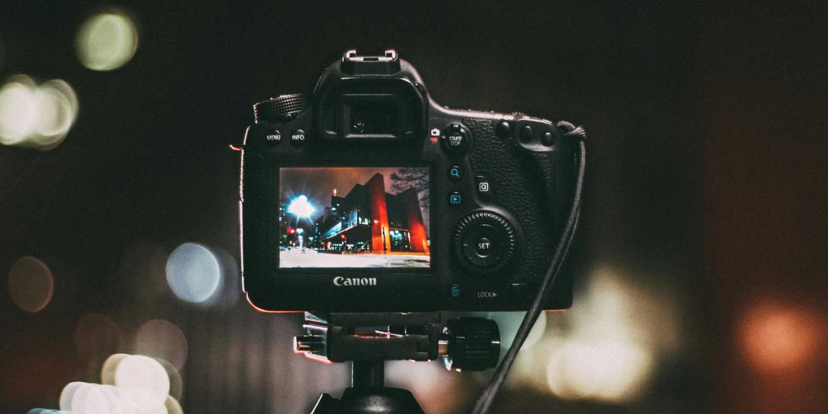 Image of a camera being mounted on a tripod and taking some photos. 