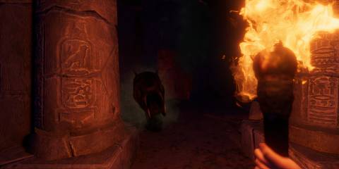 A monster coming towards the player who is holding a torch in Forewarned