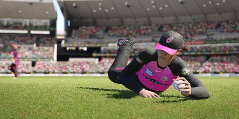 A player diving to catch a ball in Cricket 24