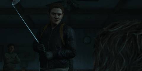 abby holds a golf club