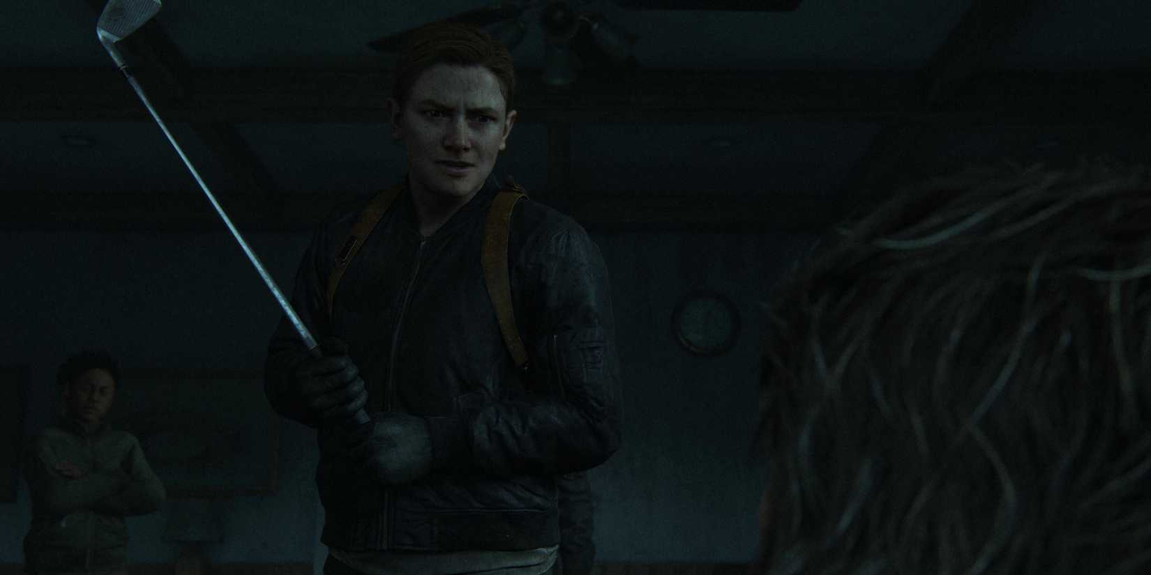 abby holds a golf club