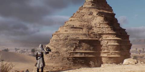 Assassin's Creed Mirage Basim standing in front of the Ziggurat of Dur-Kurigalzu