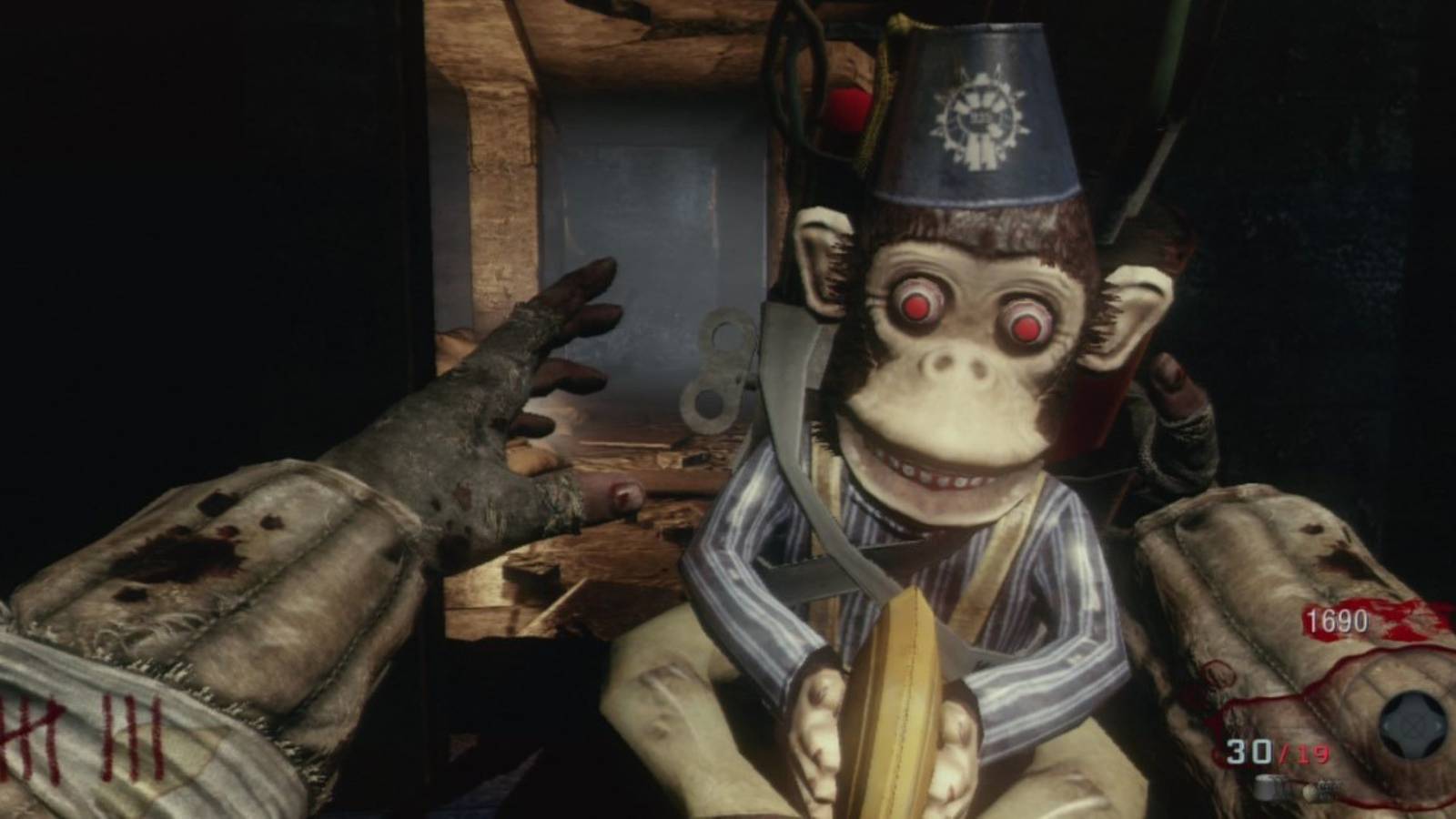 call of duty zombies player reaching for creepy monkey bomb
