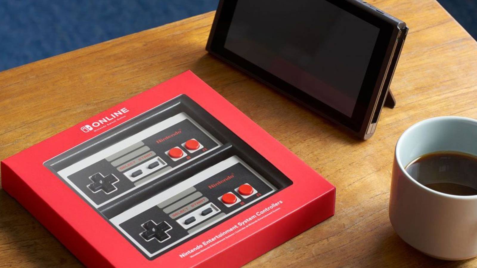 image of Switch NES controllers next to console and coffee cup