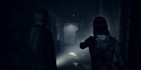 Exploring a spooky corridor by torchlight in Until Dawn