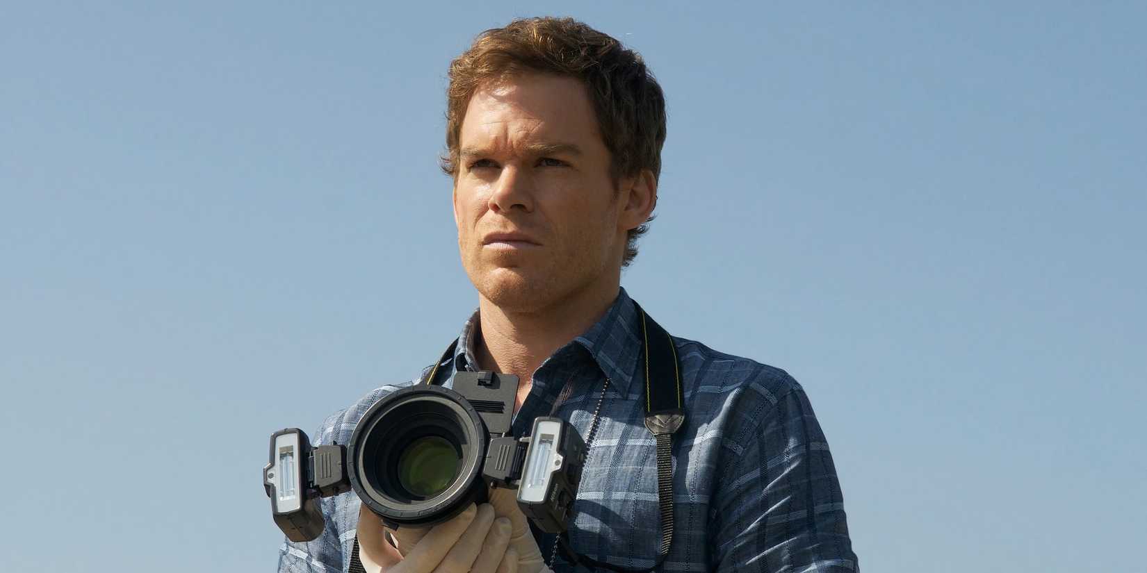 Dexter Morgan holding a camera 