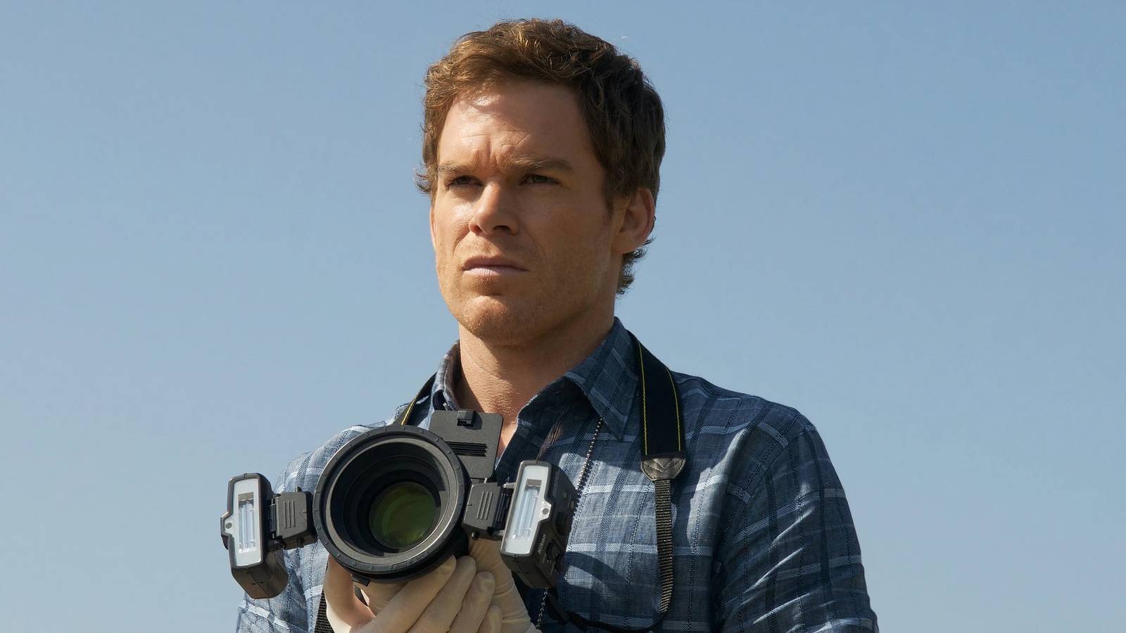 Dexter Morgan holding a camera 
