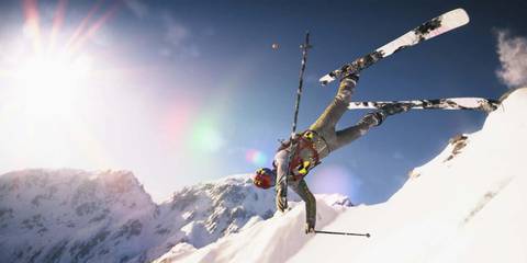 Jumping from a slope wearing skis in Steep
