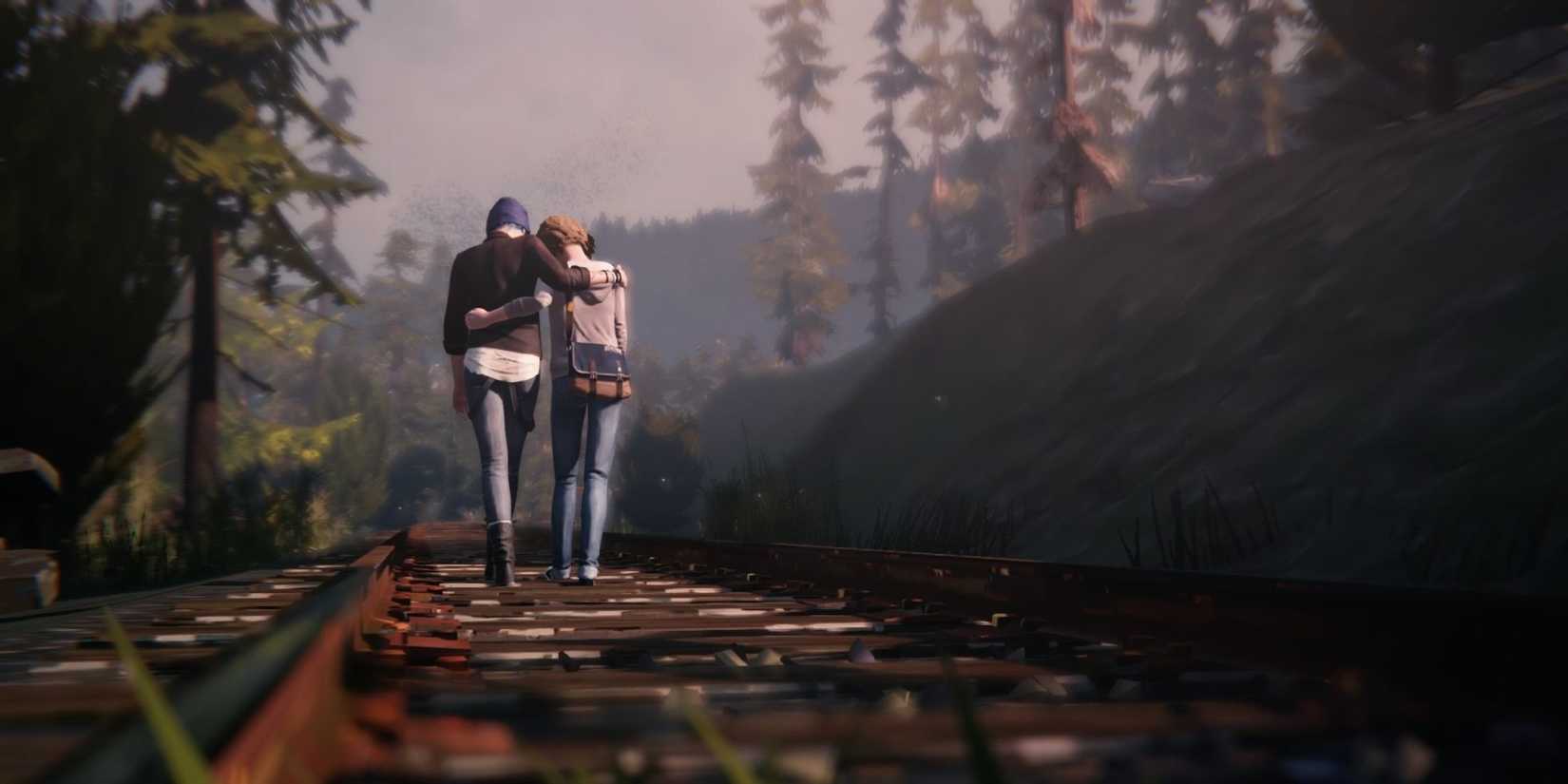 Max and Chloe walking along train tracks