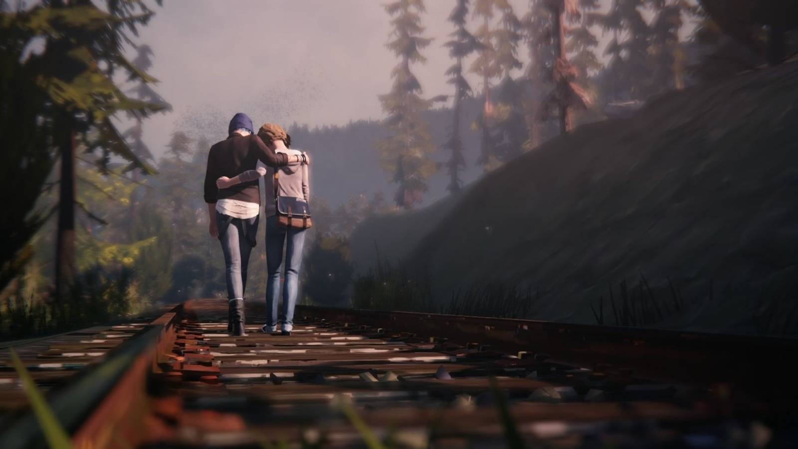 Max and Chloe walking along train tracks