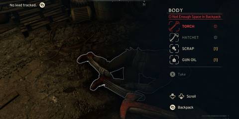 Looting a torch from a corpse in Atomfall