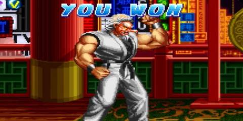 Mr. Karate, a martial artist in a white gi and tengu mask, winning a match