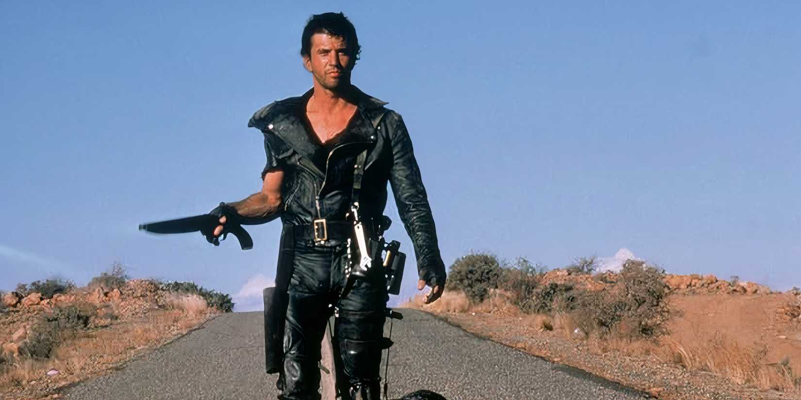 10 Best Post-Apocalyptic Movies of the 80s Max walks down a road with his shotgun