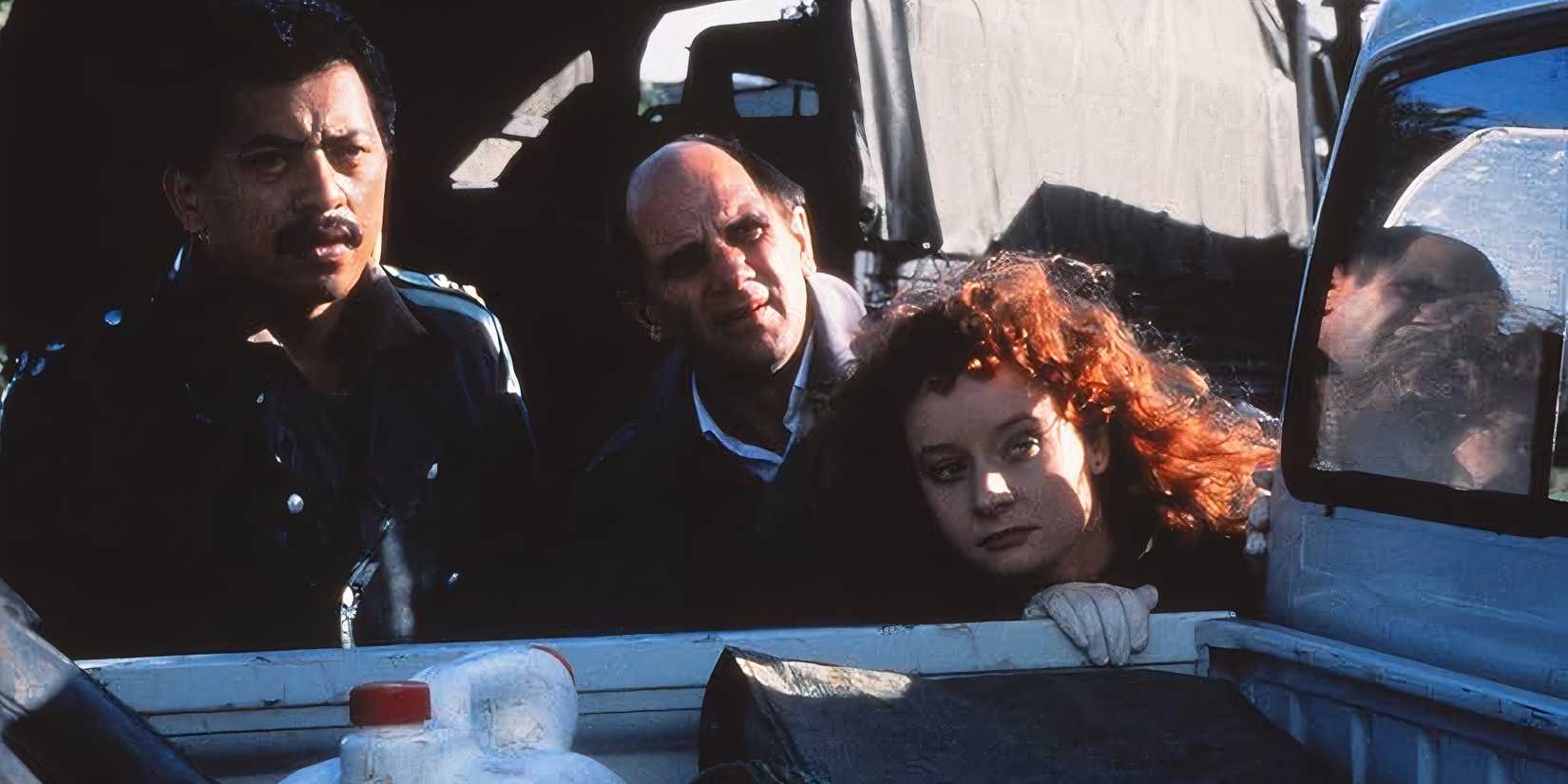 10 Best Post-Apocalyptic Movies of the 80s three people looking from behind vehicle